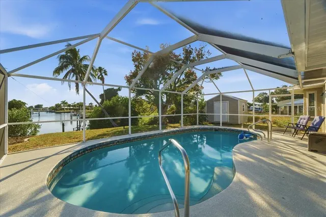 a view of a swimming pool with a patio