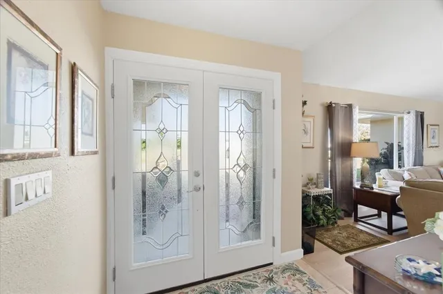 a bathroom with a glass shower door