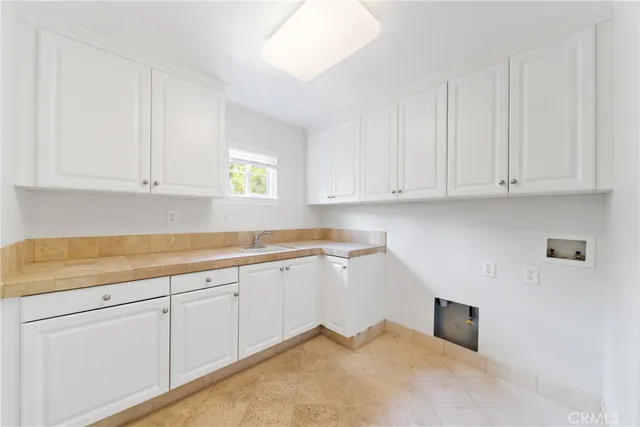 a swimming pool with an outdoor space and seating area