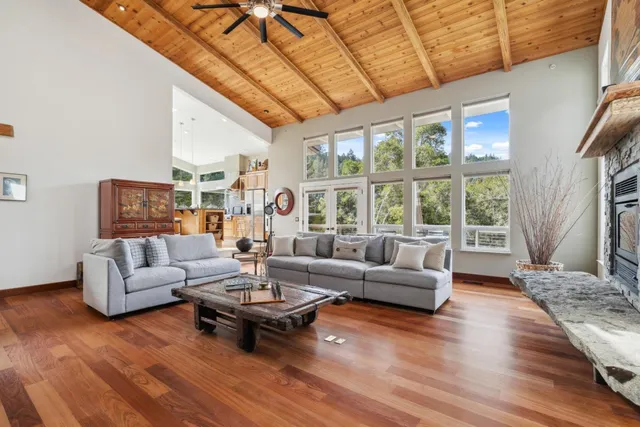 a large kitchen with kitchen island granite countertop a large counter top and stainless steel appliances