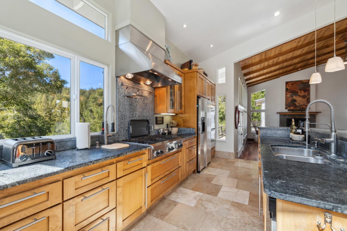 400 Dorrance Road Boulder Creek, CA 95006 - Photo 19 of 62 a large kitchen with kitchen island granite countertop a large counter top and stainless steel appliances
