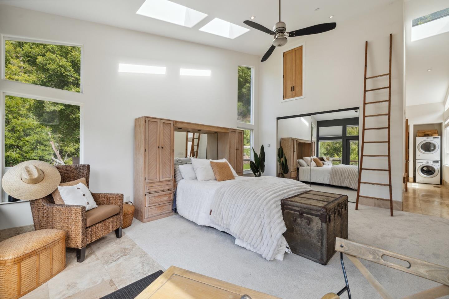 400 Dorrance Road Boulder Creek, CA 95006 - Photo 22 of 62 a bedroom with a bed and wooden floor