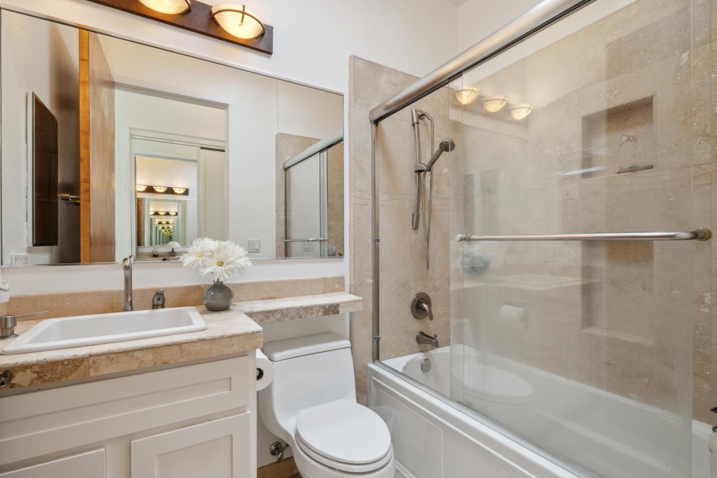 400 Dorrance Road Boulder Creek, CA 95006 - Photo 30 of 62 a bathroom with a granite countertop bathtub shower sink vanity mirror and toilet