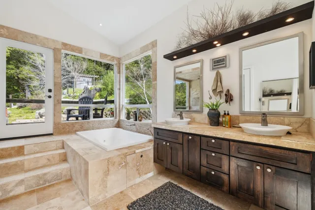 a kitchen with granite countertop a refrigerator and a sink