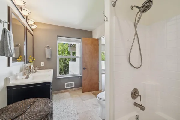 a view of a bathroom with a glass door shower