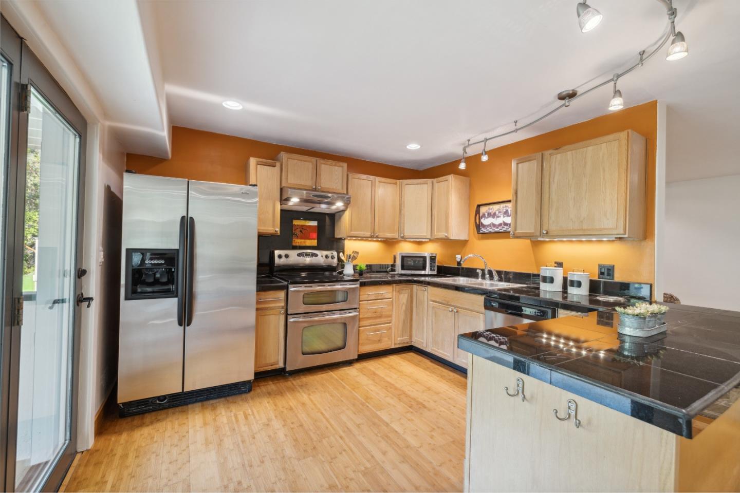 400 Dorrance Road Boulder Creek, CA 95006 - Photo 37 of 62 a kitchen with granite countertop a refrigerator and a sink