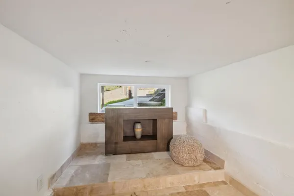 a bedroom with a bed and a couch