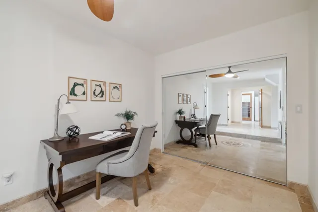 a kitchen with a sink stove and wooden floor