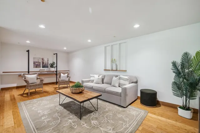 a bedroom with a bed and a couch