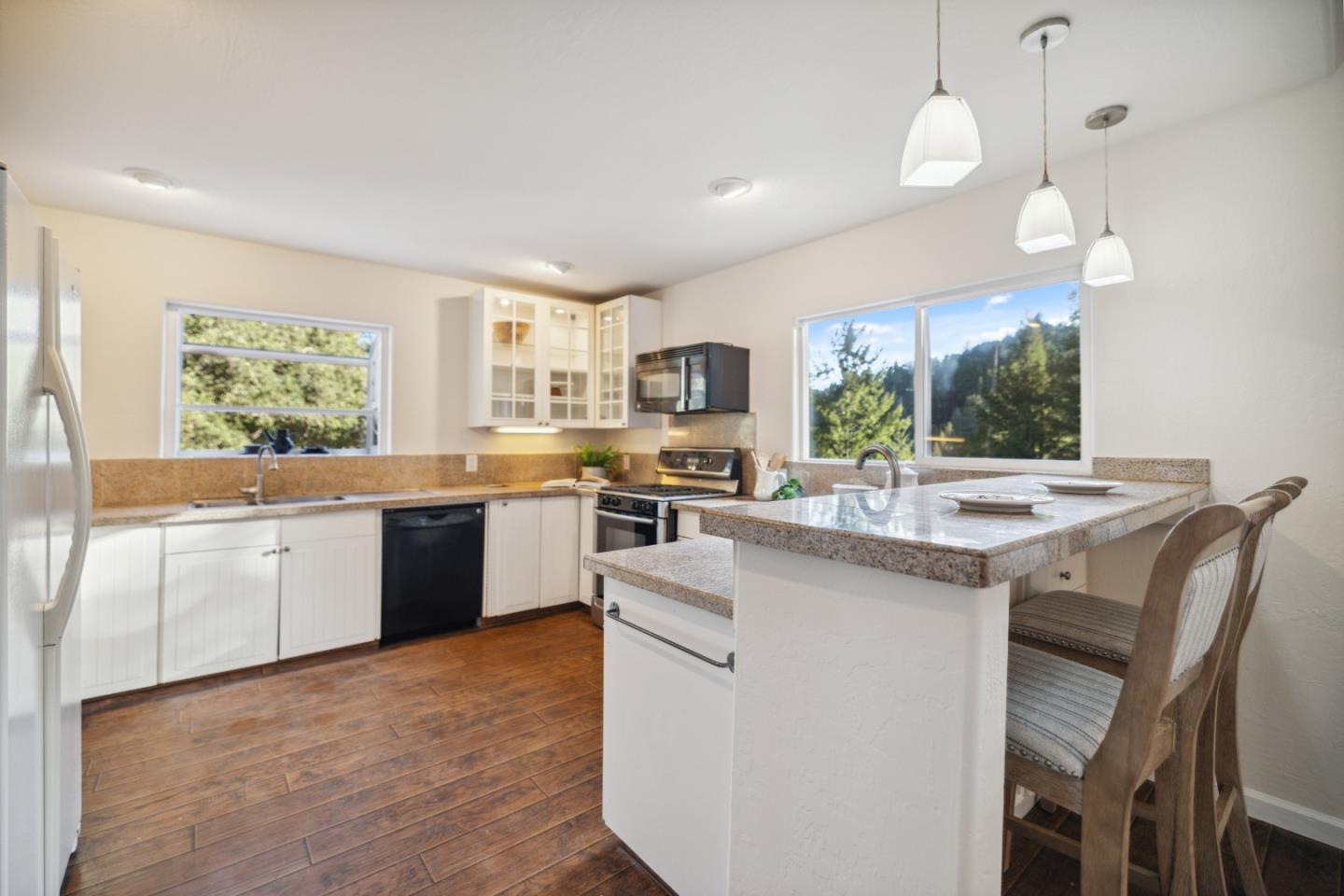 400 Dorrance Road Boulder Creek, CA 95006 - Photo 48 of 62 a kitchen with a sink stove and wooden floor