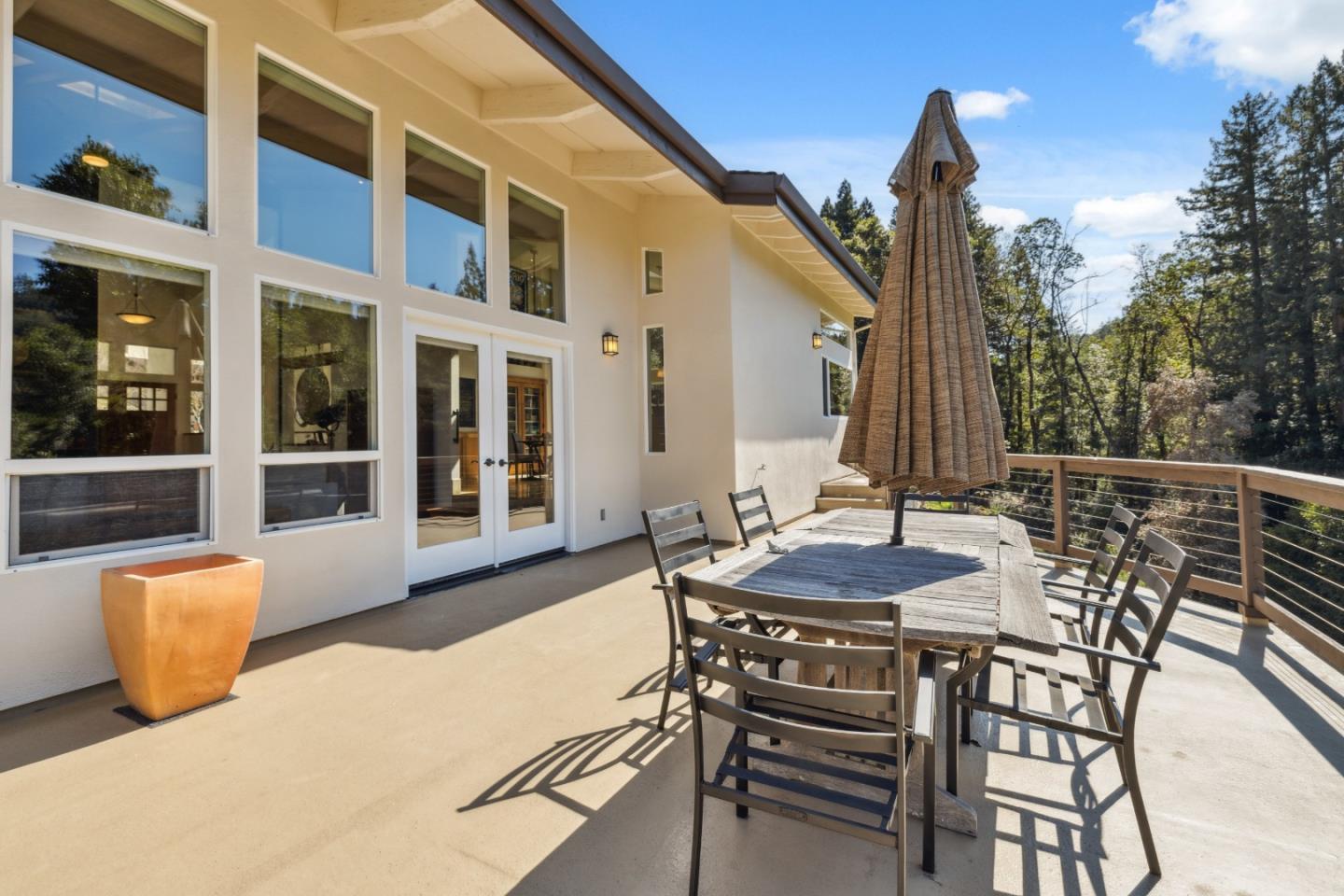 400 Dorrance Road Boulder Creek, CA 95006 - Photo 5 of 62 a view of a patio with table and chairs