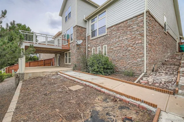 a view of a grassy field with an trees