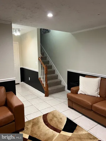 a view of livingroom with furniture and cabinet