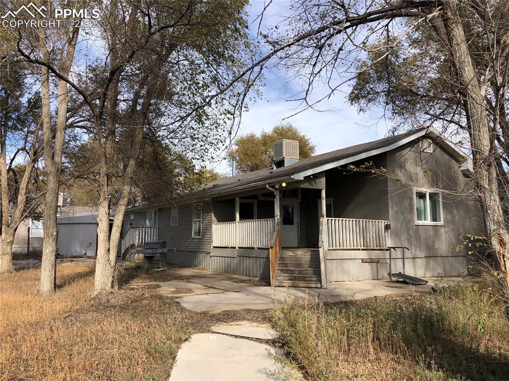 9260 County Road East Olney Springs, CO 81062 - Photo 2 of 11 a view of a house with a yard covered in snow