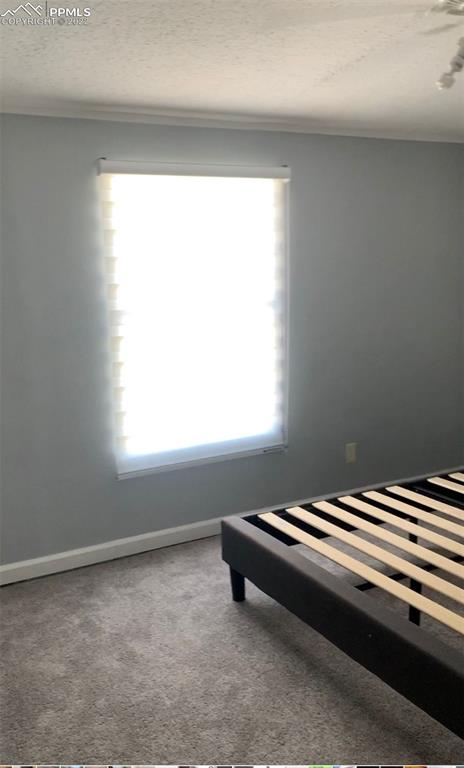 9260 County Road East Olney Springs, CO 81062 - Photo 5 of 11 a bedroom with a bed and a window