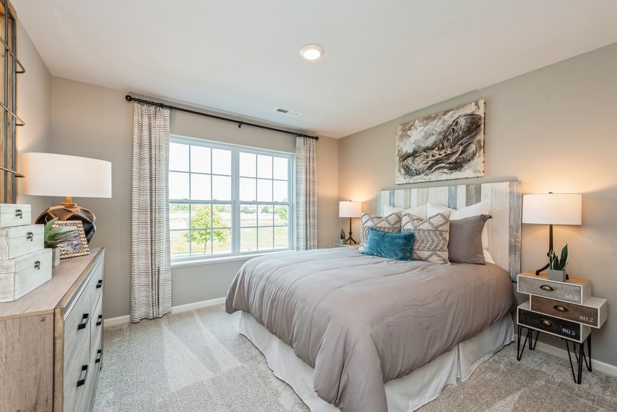 1218 Draper Road McHenry, IL 60050 - Photo 11 of 30 a bedroom with a bed and a window