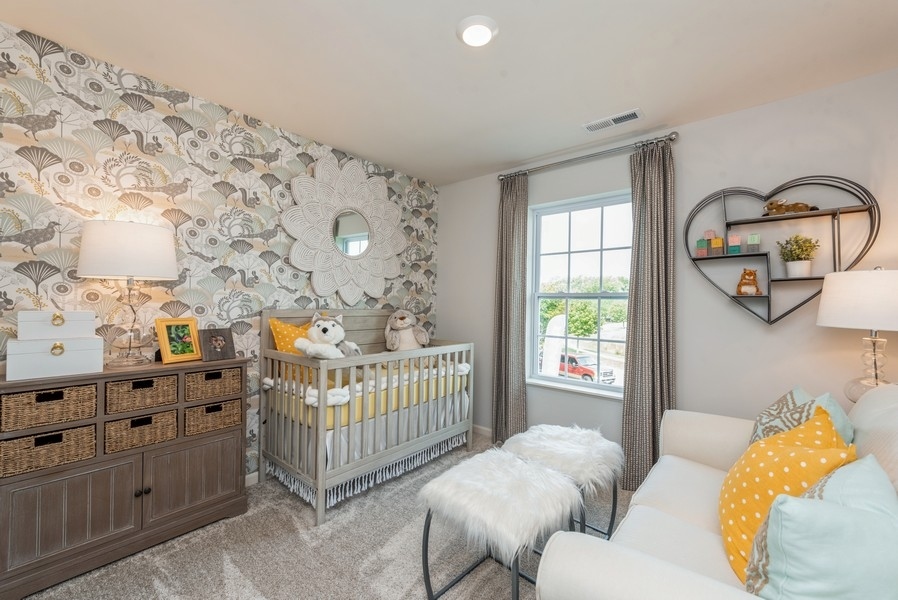 1218 Draper Road McHenry, IL 60050 - Photo 12 of 30 a bedroom with baby crib and a window