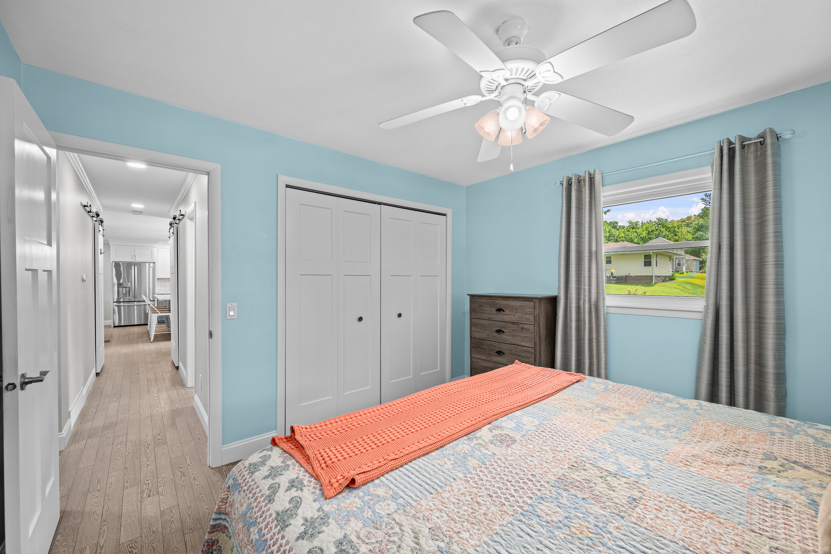 506 Bush Street Reynolds, IL 61279 - Photo 20 of 37 a bedroom with a bed and a chandelier