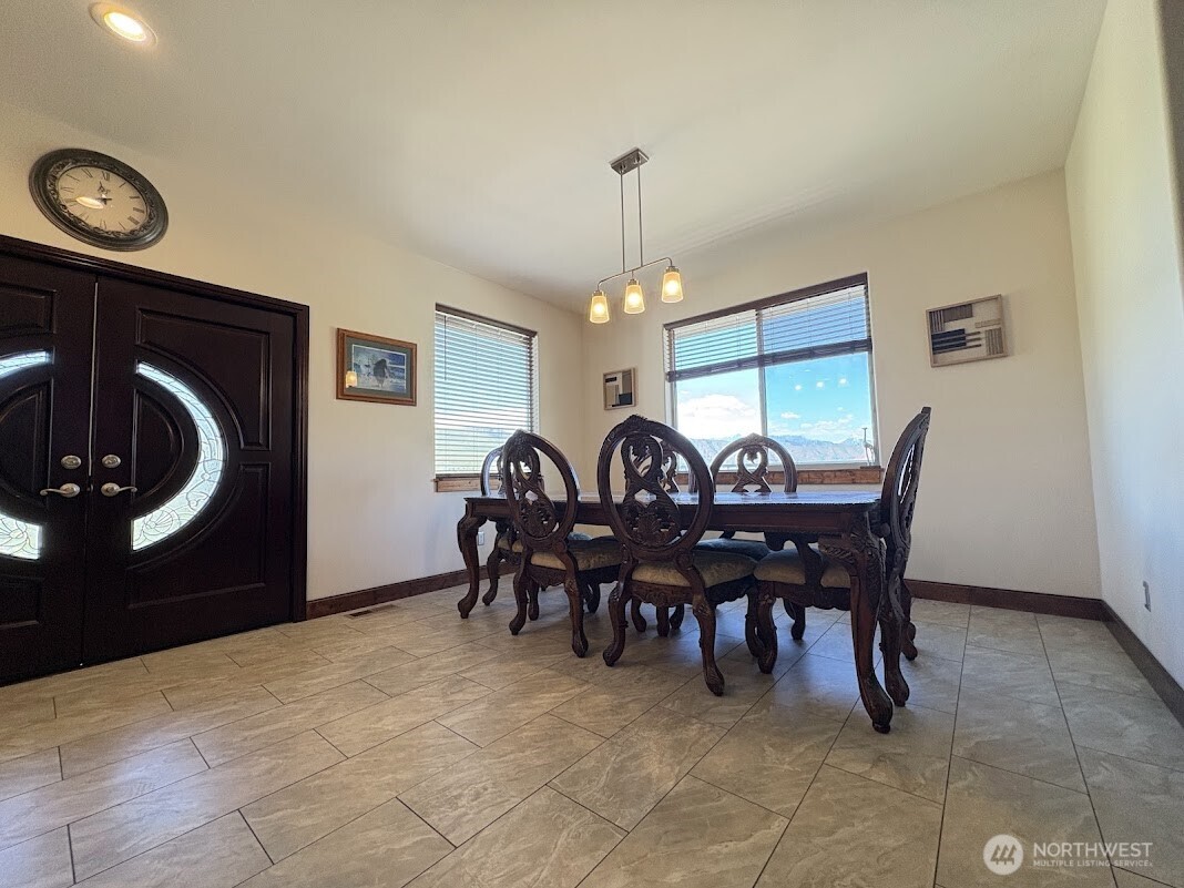 1515 American Fruit Road Wenatchee, WA 98801 - Photo 12 of 35 a view of a dining room with furniture and chandelier