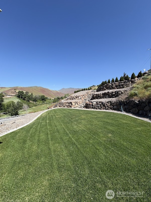 1515 American Fruit Road Wenatchee, WA 98801 - Photo 4 of 35 a view of a field with an trees