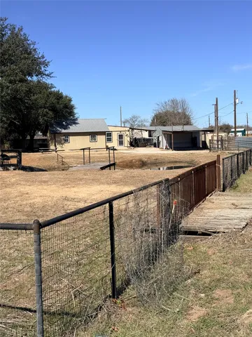 a view of a terrace with wooden fence