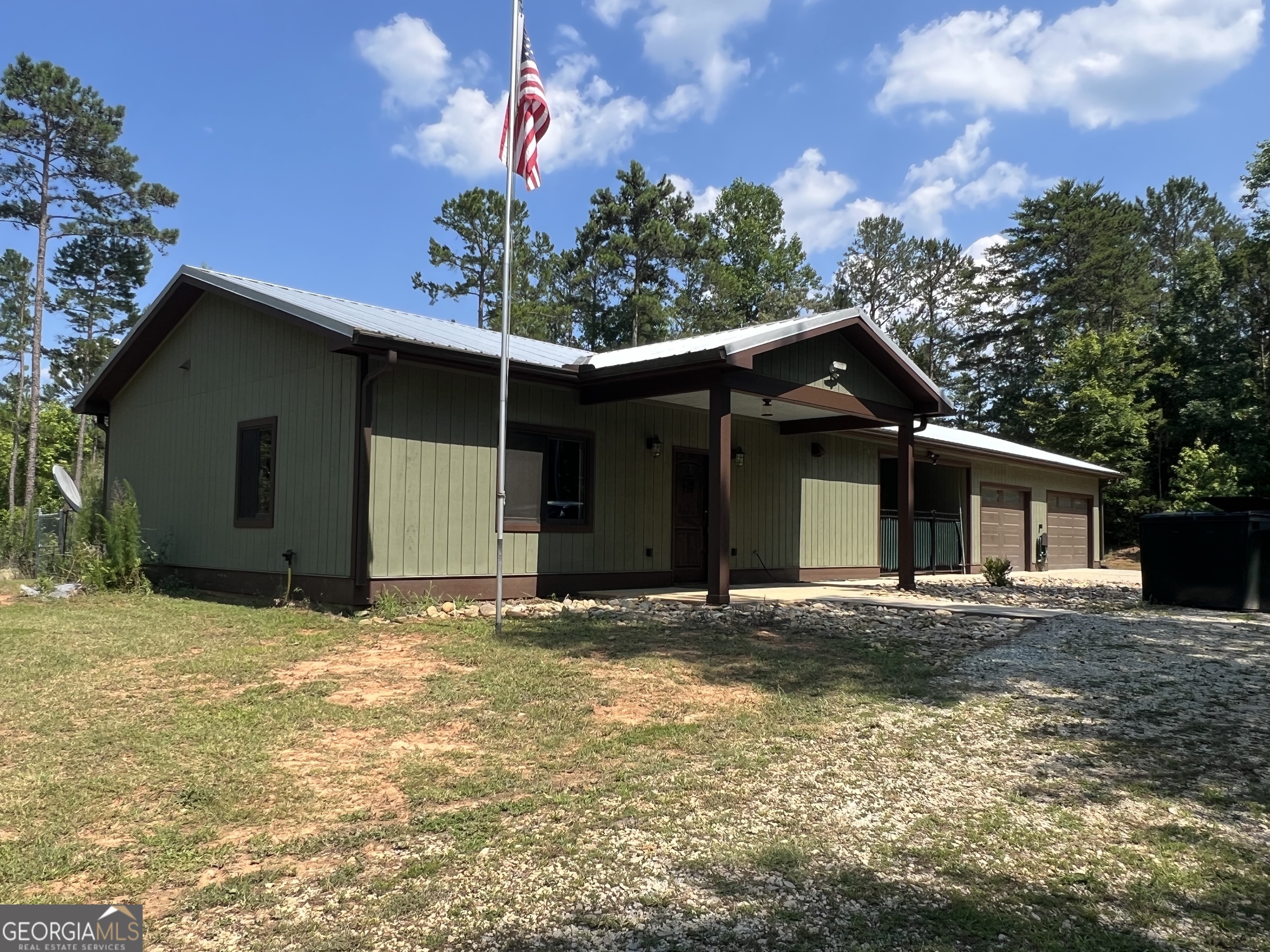 2160 Luther Burton Road Elberton, GA 30635 - Photo 1 of 1 a front view of a house with a yard and garage