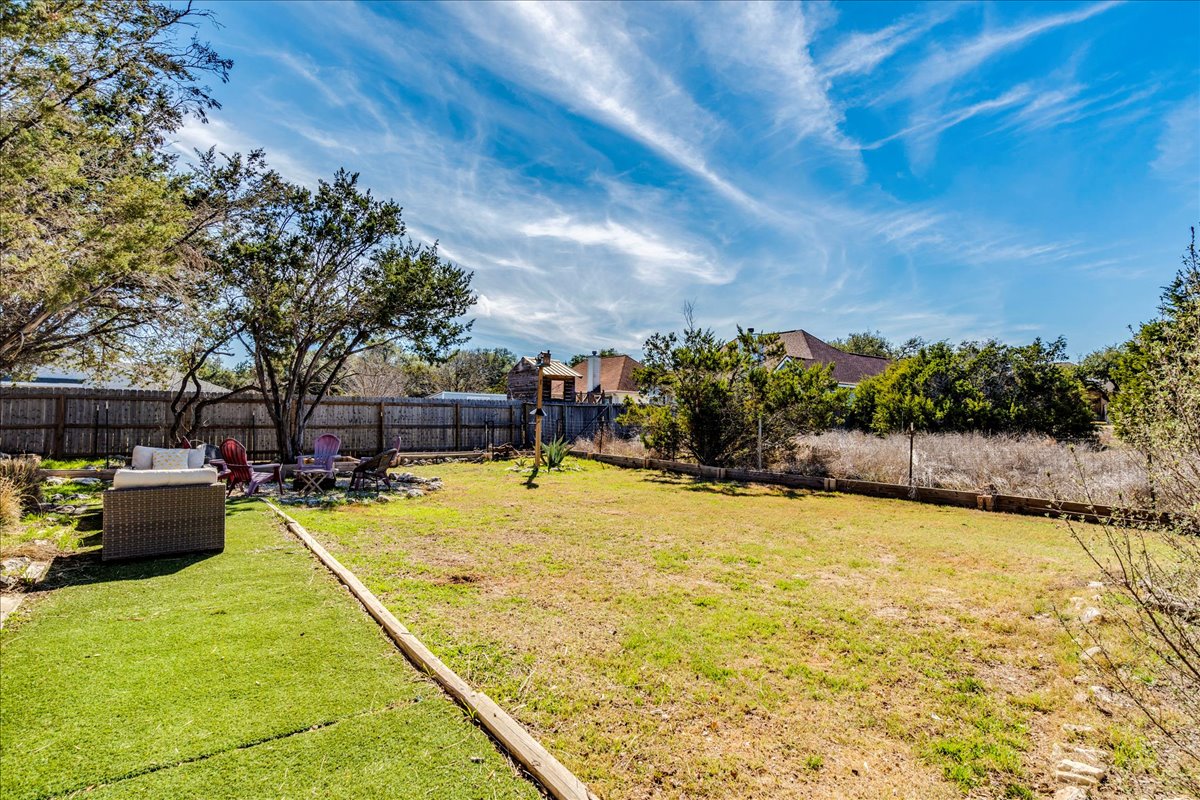 11 Rhapsody Lane Wimberley, TX 78676 - Photo 29 of 35 a swimming pool with some trees in the background