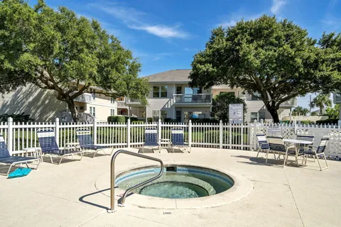 a view of a swimming pool and lounge chair