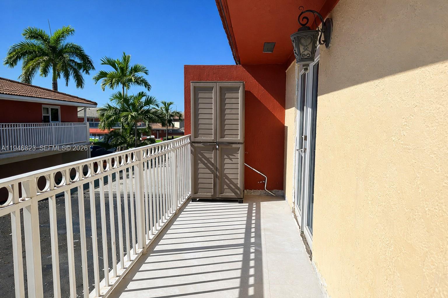 10923 West Okeechobee Road, Unit 201 Hialeah Gardens, FL 33018 - Photo 2 of 13 a view of a balcony
