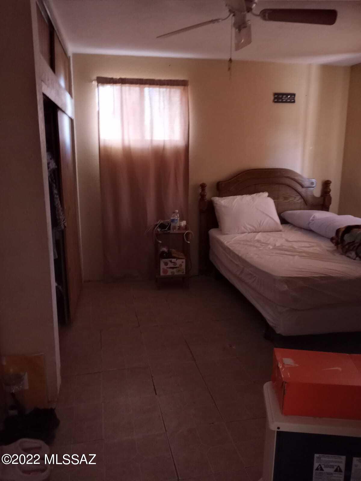 Undisclosed Address Douglas, AZ 85607 - Photo 14 of 16 a bedroom with a bed and a mirror