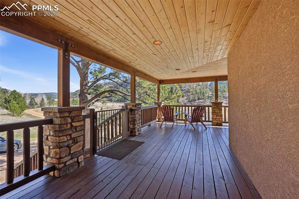 89 Ranch View Road Florissant, CO 80816 - Photo 10 of 50 Enter the property through a captivating wrap-around covered front porch.