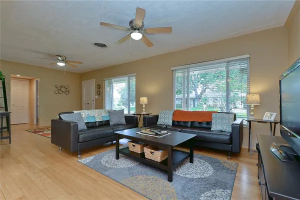 a view of a dining room with furniture and wooden floor