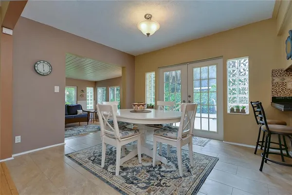 a kitchen with granite countertop a stove cabinets and microwave