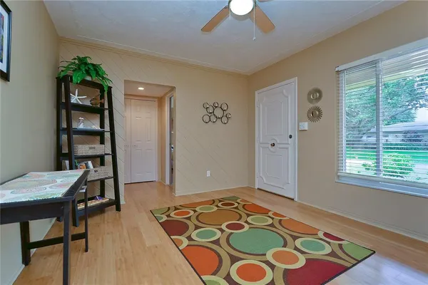 a bedroom with a bed and a lamp