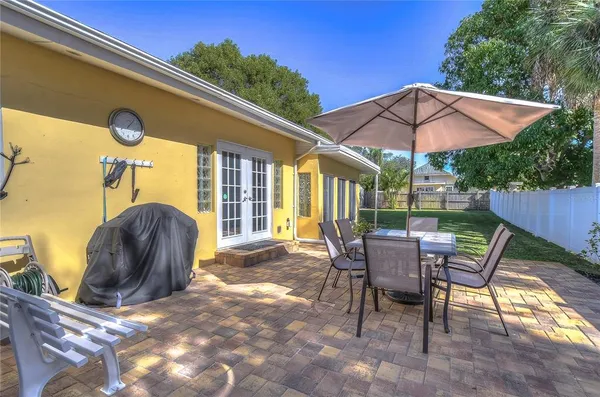 a view of a chair and table on the wooden floor