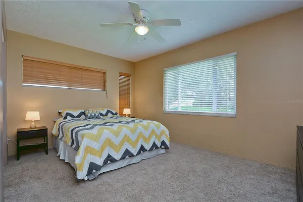 a bedroom with a bed and window