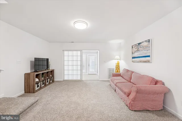 a spacious bedroom with a bed and a couch