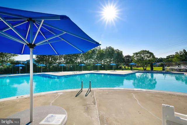 a view of a swimming pool with a patio