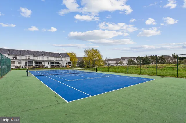a view of an outdoor space and tennis court