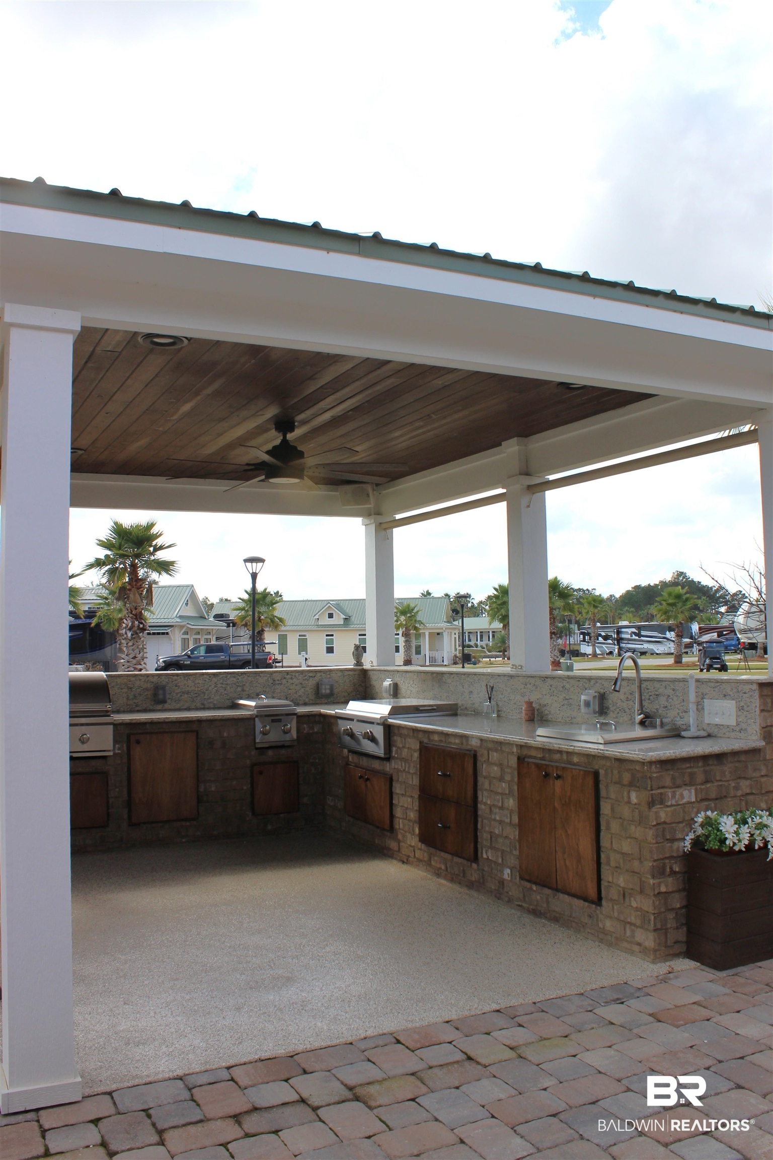28238 Migratory Way Elberta, AL 36530 - Photo 16 of 58 View of patio / terrace with exterior kitchen, ceiling fan, and a residential view