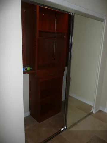 a view of empty room with a fireplace