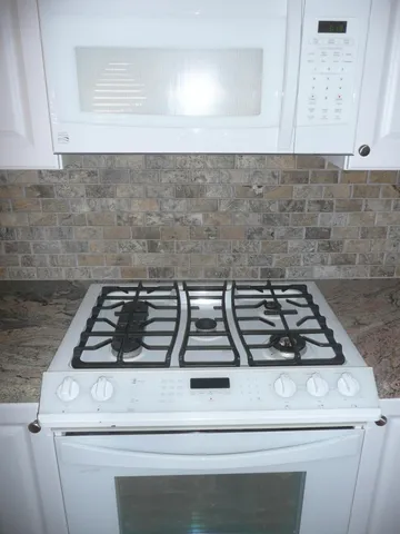 a view of a kitchen with a sink