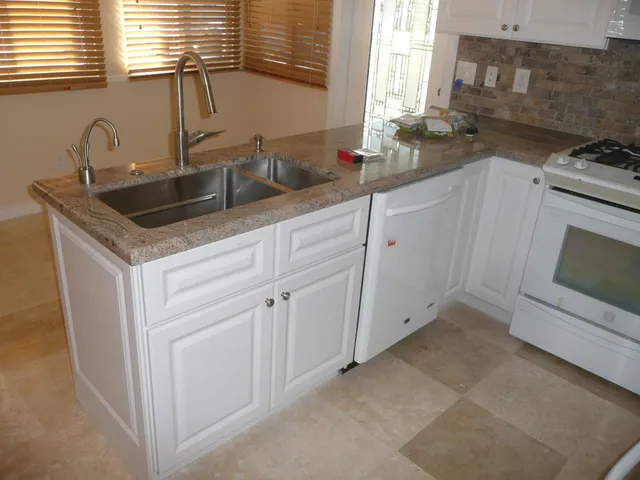 a bathroom with a shower and a sink