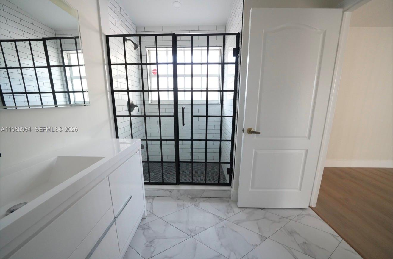 9921 Southwest 164th Court Miami, FL 33196 - Photo 11 of 20 a bathroom with a bathtub and shower