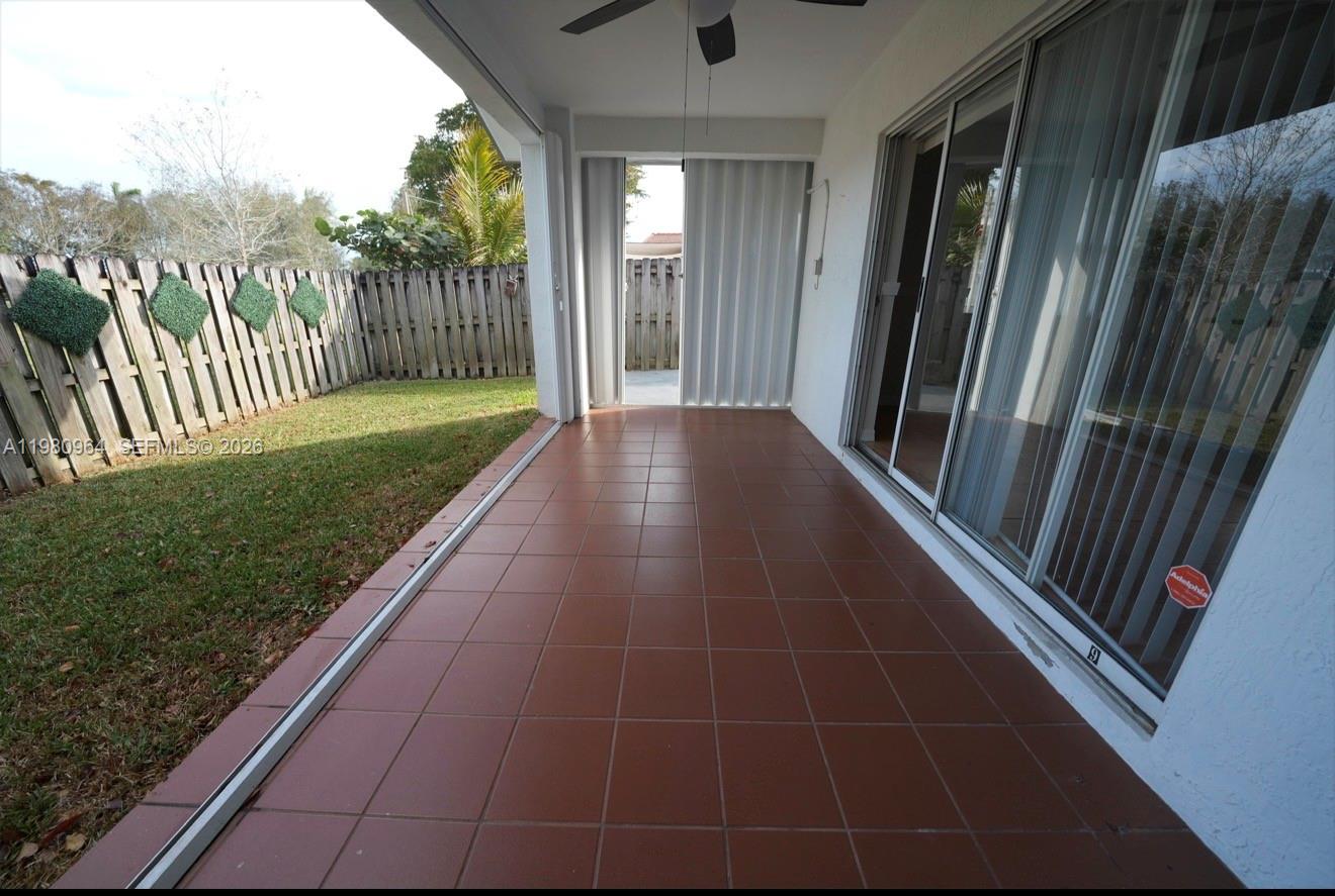 9921 Southwest 164th Court Miami, FL 33196 - Photo 17 of 20 a view of balcony with furniture