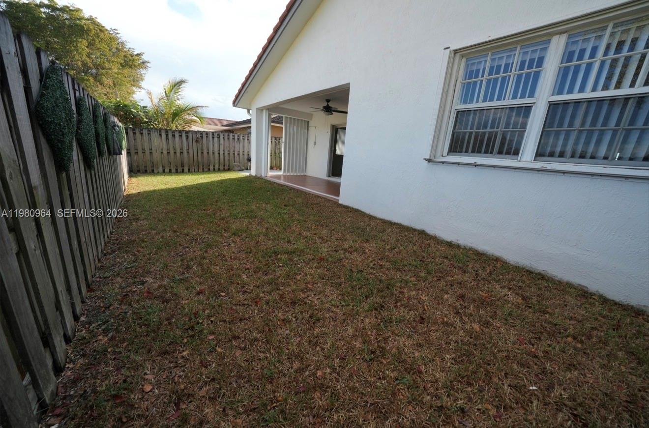 9921 Southwest 164th Court Miami, FL 33196 - Photo 19 of 20 a view of backyard and balcony