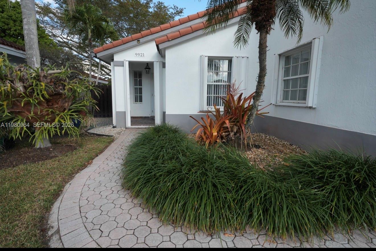9921 Southwest 164th Court Miami, FL 33196 - Photo 2 of 20 a front view of house with yard and green space