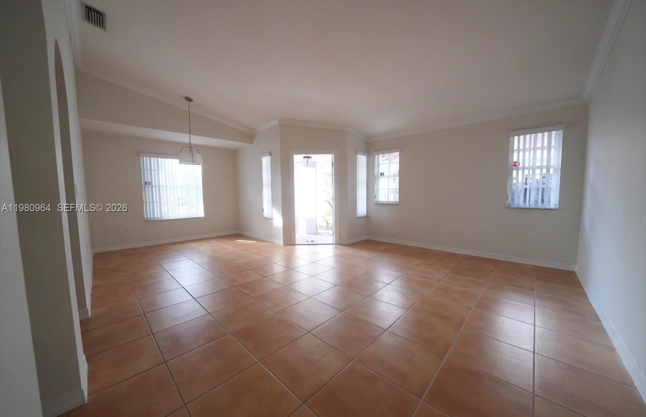 9921 Southwest 164th Court Miami, FL 33196 - Photo 3 of 20 a view of an empty room with windows