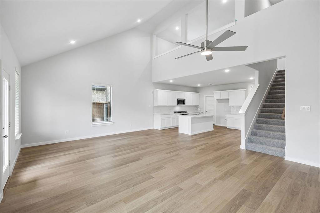 1460 Companero Street Haslet, TX 76052 - Photo 35 of 35 an empty room with wooden floor and windows