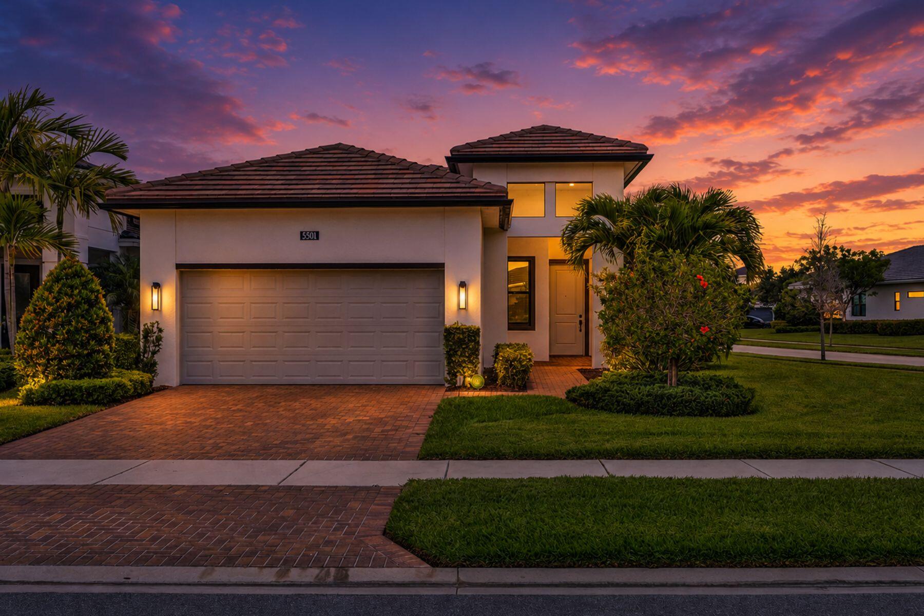 5501 Santa Rosa Lane Westlake, FL 33470 - Photo 2 of 31 a front view of a house with a yard and garage